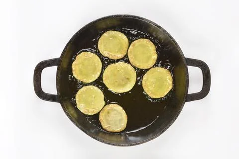 Frying Battered Zucchini Slices in Cast Iron Skillet Stock Photos