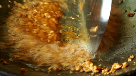 Frying bean paste with garlic in pan, in door  Chiangmai  Thailand. Stock Footage 274172360
