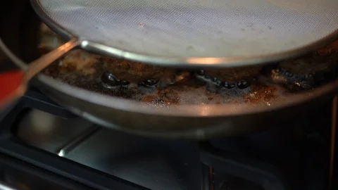 Frying beef and pork cutlets in olive oil in iron cast frying pan. Juicy meat Stock Footage 129317637