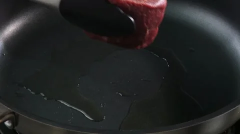 Frying beef fillet in a frying pan Video stock 8572780
