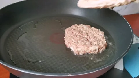 Frying a Beef Patty Steak in a Pan Stock Footage 231119554