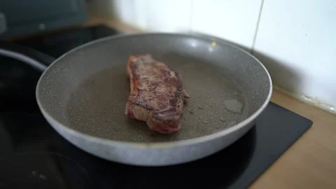 Frying Beef Steak in a Pan Stock Footage 280434055