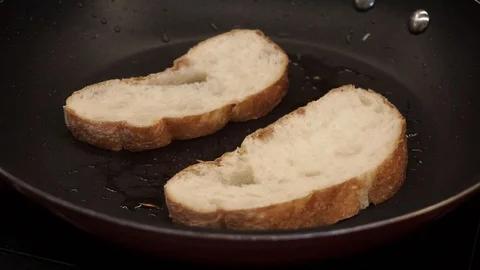 Frying bread in oil Stock Footage 113527663