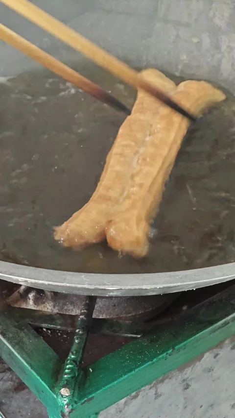 Frying bread sticks Stock Footage 286918563