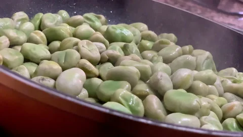 Frying broad beans Stock Footage 202609187