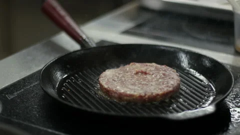 Frying burger meat on hot pan. Media. Footage of traditional American hamburger Stock-Footage 150580511