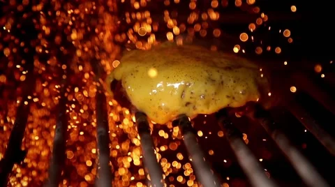 Frying burger in slow motion Stock Footage 67860450