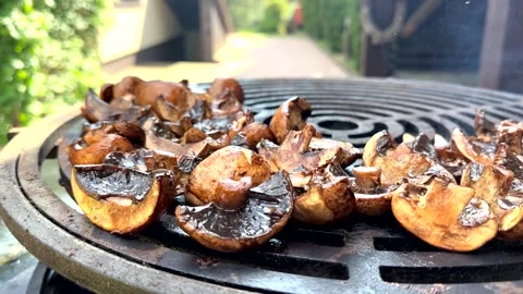 Frying champingons mushrooms on open flame Video stock 249143390