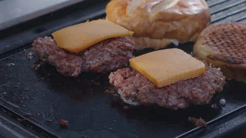 Frying Cheeseburgers to Perfection Video stock 258299465