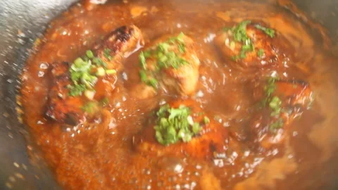 Frying chicken breast with red wine sauce in pan , in door  Chiangmai  Thailand Stock Footage 152033095