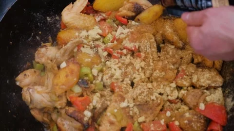 Frying chicken in a cauldron. Chicken meat in a cauldron. Outdoor cooking Stock-Footage 278463210