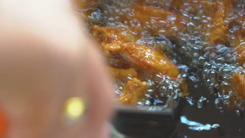 Frying chicken in fried pot with boiling hot cooking oil Stock Footage 164600269