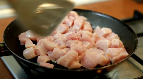 Frying chicken on frying pan Stock Footage