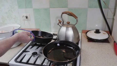 Frying chicken in a frying pan on a gas stove. Stock Footage 233199288