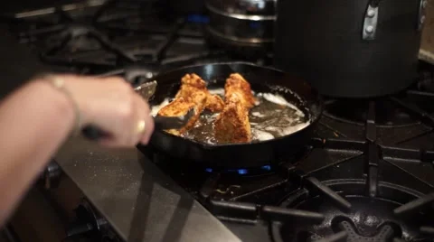 Frying Chicken at Home Stockbeeldmateriaal 51173494