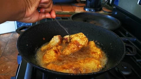Frying Chicken at Home Stock Footage 168336764