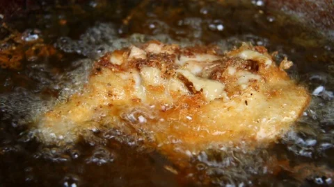 Frying chicken leg in pan Stock Footage 89153174