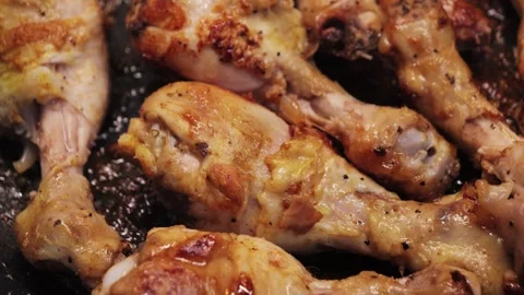 Frying chicken legs in a frying pan. Close up of bbq chicken legs. Stock Footage 330520838