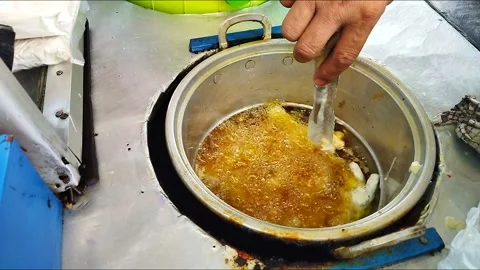 Frying chicken legs which are commonly called claws in a pan Stock Footage 213203797