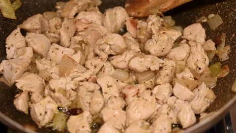 Frying chicken meat in pot. Stock Footage 312358118