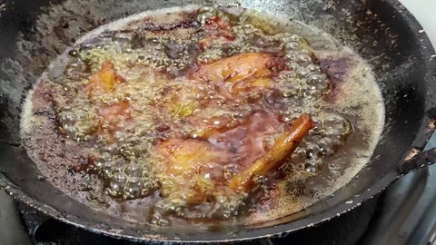 Frying chicken in old pan or wok Video stock 280915479