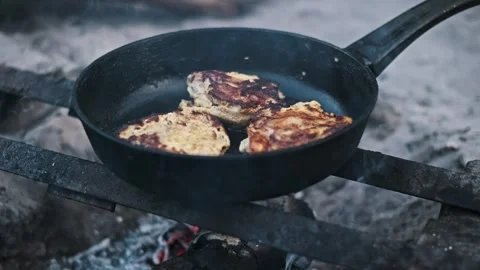 Frying Chicken Over Campfire Stock Footage 303757644