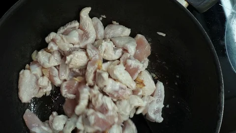 Frying chicken overhead Stock Footage 98360877