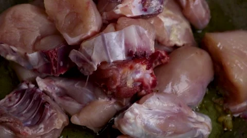 Frying Chicken in a pan Stock Footage 135259975