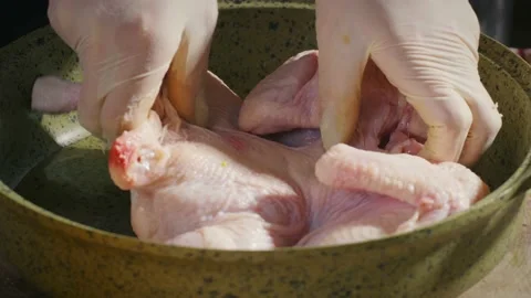Frying a chicken in a pan with oil Stock Footage 138127456