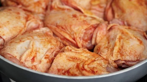 Frying chicken with spices Stock Footage 81718806