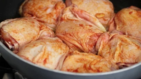 Frying chicken with spices Stock Footage 81718814