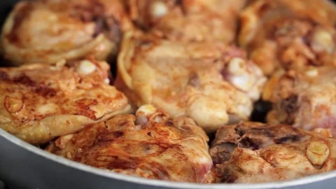 Frying chicken with spices Stock Footage 81718879