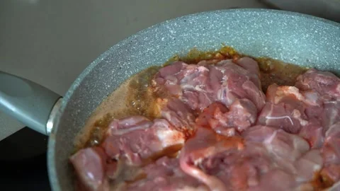 Frying chicken thighs on pan Stock Footage 161158553