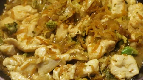 Frying chicken with vegetables Stock Footage 127024833