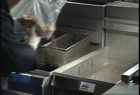 Frying Chicken Wings 2 - 2 shot Stock Footage 145738