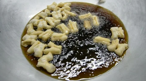 Frying Chinese Donut In Big Pan Stock Footage 38285049