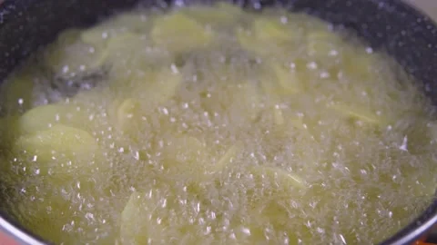 Frying chips in oil, sliced potato, clean, fresh oil Stock-Footage 206072307