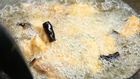 Frying chopped catfish  in pan , in door  Chiangmai  Thailand. Stock Footage 153075933