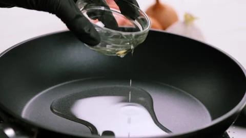 Frying chopped onion on the frying pan close up Stock Footage 149573457