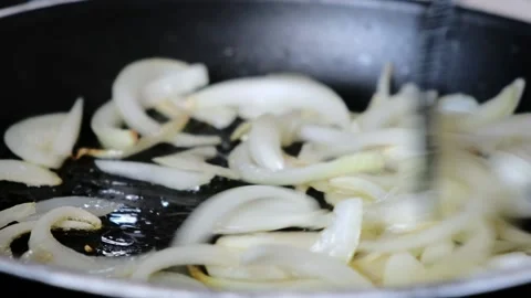 Frying chopped onion in frying pan. Cooking pasta sauce. Full hd Stock Footage 161779574