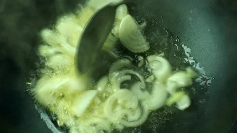 Frying chopped   onion in pan, in door  Chiangmai  Thailand Stock Footage 235667946