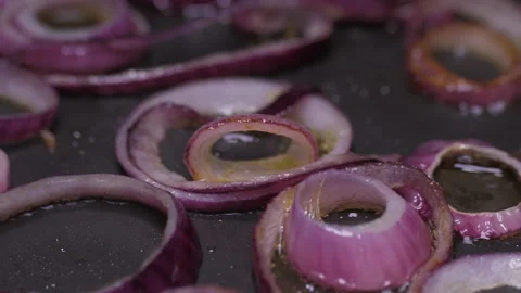 Frying chopped onion rings on pan slow motion 4k Stock Footage 149664592