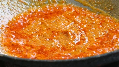 Frying chopped pork with chili paste to make curry, Thai food Stock Footage 112598912