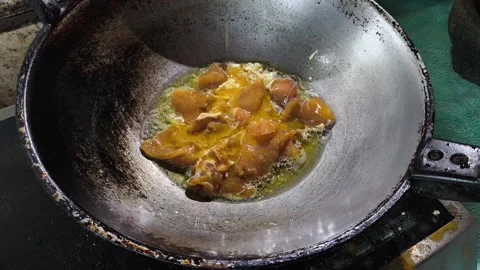 Frying chopped pork with egg in pan , in door  Chiangmai  Thailand Stock Footage 308210643