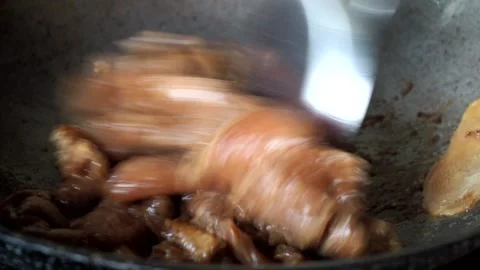 Frying chopped pork with ginger in pan, in door  Chiangmai  Thailand. Stock Footage 285280178
