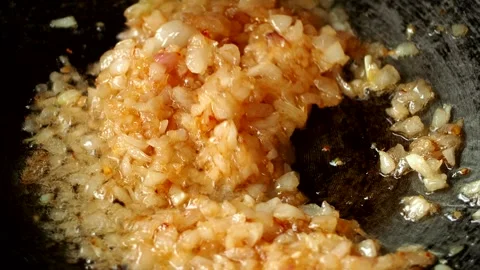 Frying chopped red onion in pan, in door Chiangmai Thailand. Stock Footage 280806383