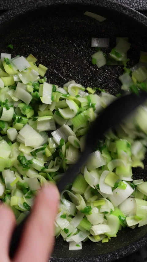 Frying Chopped Vegetables Close Up Top View Vertical Stock Footage 337190382