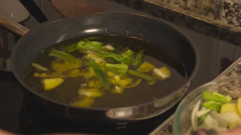 Frying chopped vegetables in hot oil Stock-Footage 331314034