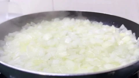 Frying chopped white onion in frying pan. Close up shot 動画素材 224709061
