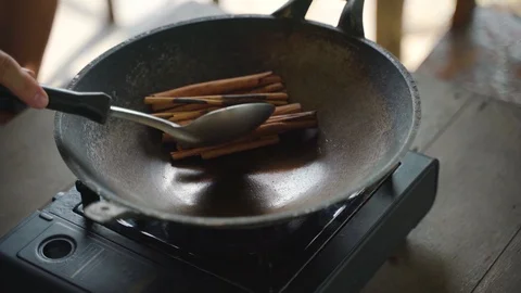 Frying cinnamon stick with pan Video stock 95182617